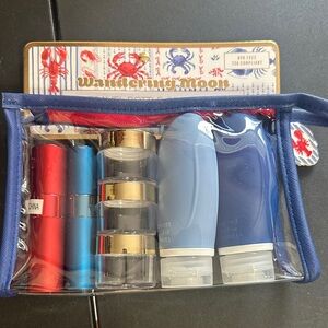 Wandering moon with toiletry bottles, perfume, atomizers, and jars plastic bag